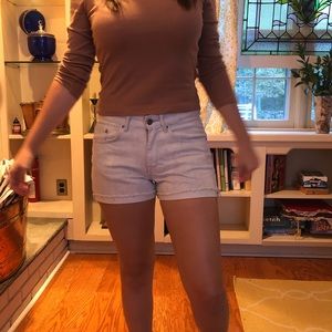 Light wash shorts with a white floral pattern